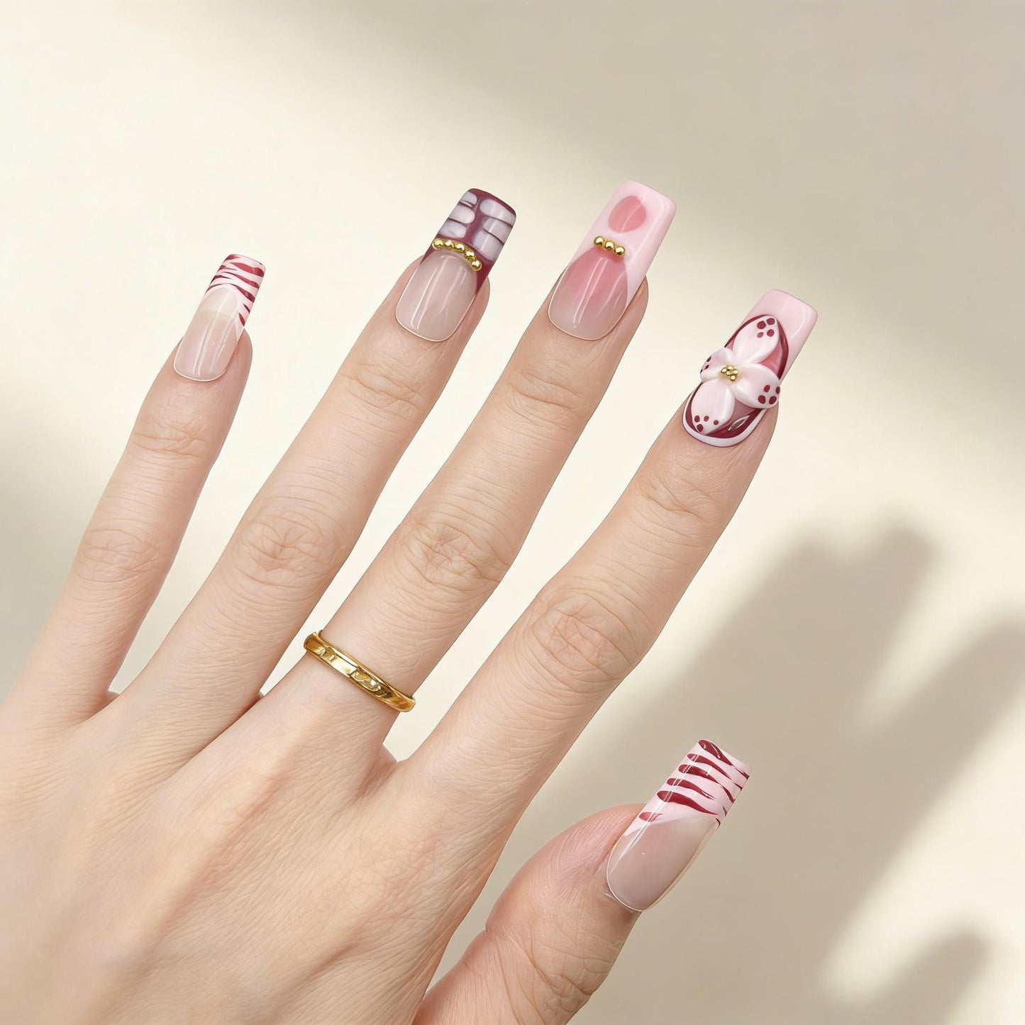 Red White Floral Press-On Nails - Glitter Gold Accent Nails UK - lifestyle view - ClouDIY UK