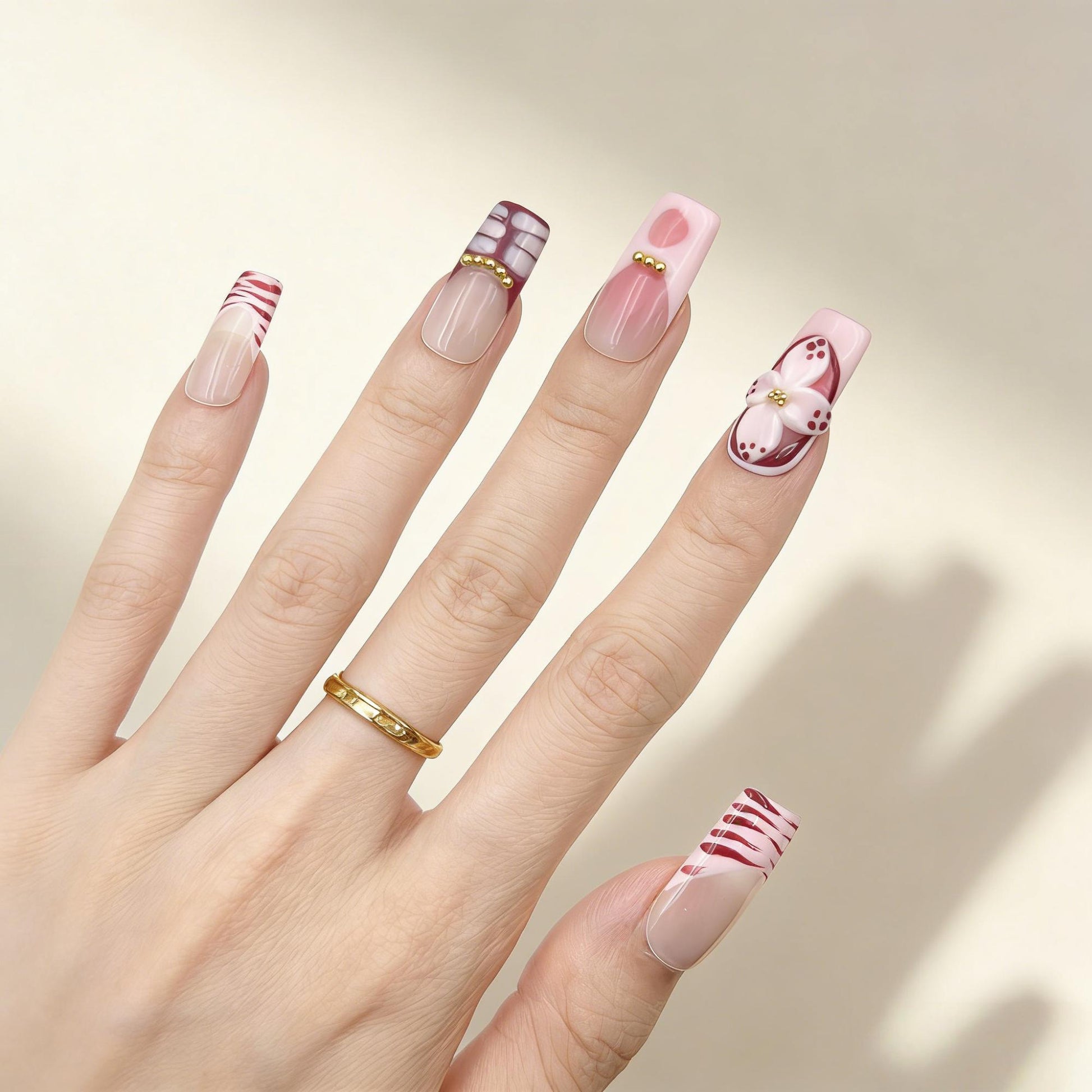 Red White Floral Press-On Nails - Glitter Gold Accent Nails UK - lifestyle view - ClouDIY UK