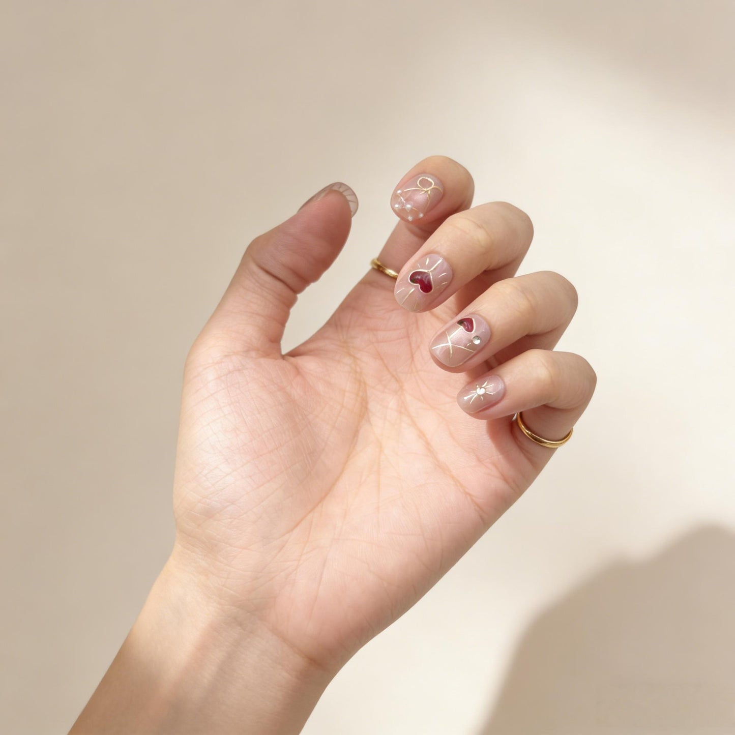 Blush Red Heart Press-On Nails - Gold Line False Nails UK - lifestyle view - ClouDIY UK